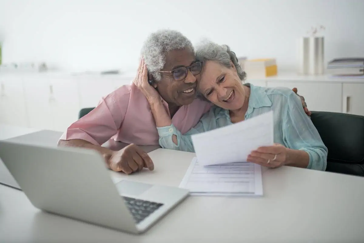 A-Happy-Elderly-Couple-Holding-a-Document