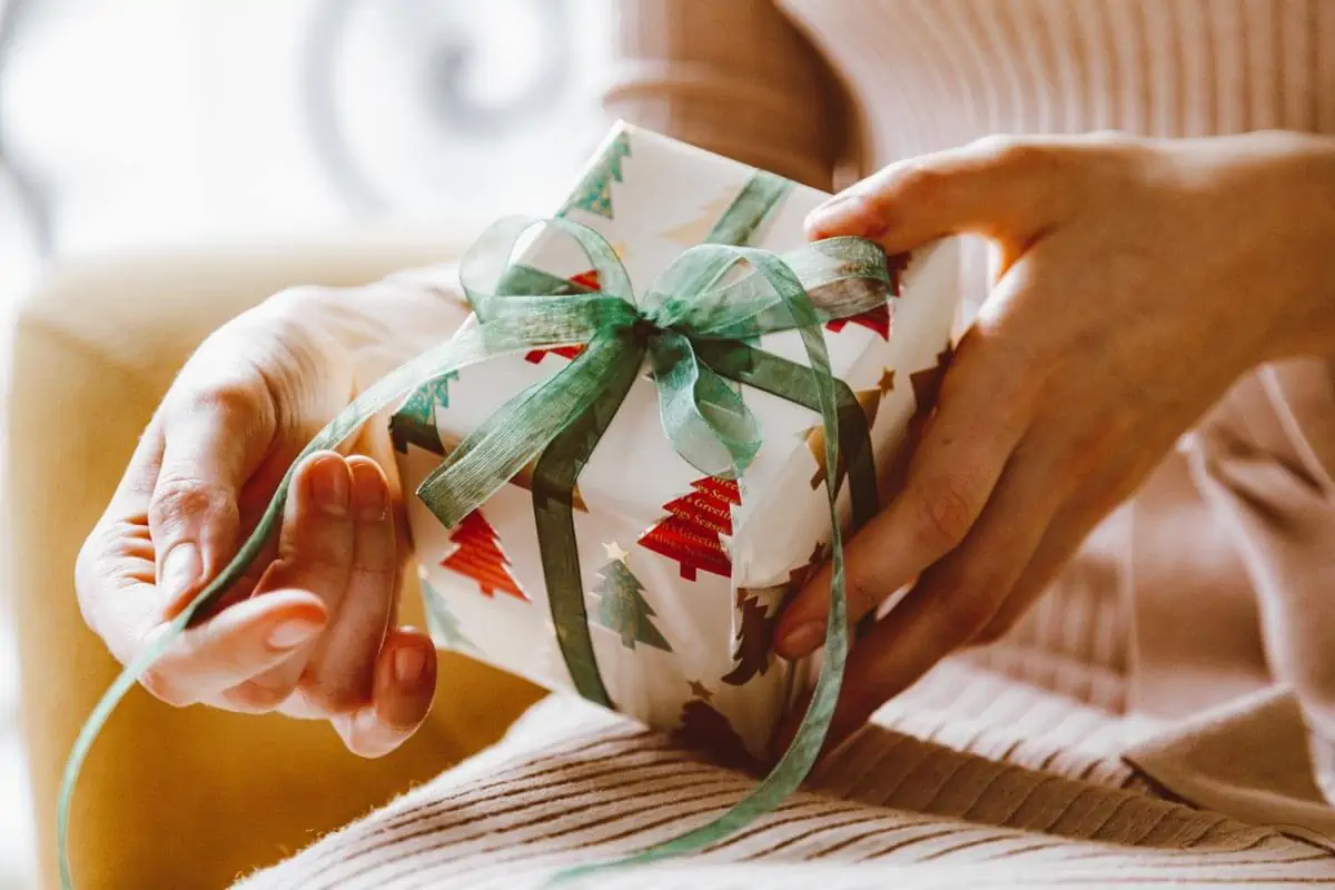 Close-Up-of-Woman-Hands-Holding-Christmas-Gift