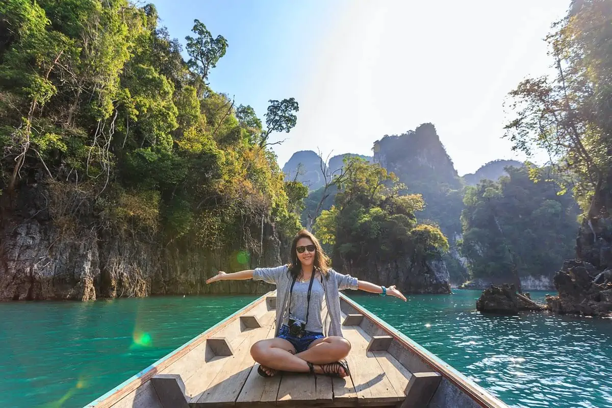 Woman-Sitting-on-Boat-Spreading-Her-Arms